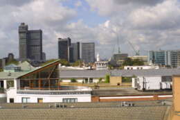 Three Oak Lane terrace with london skyline behind