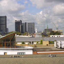 Three Oak Lane terrace with london skyline behind